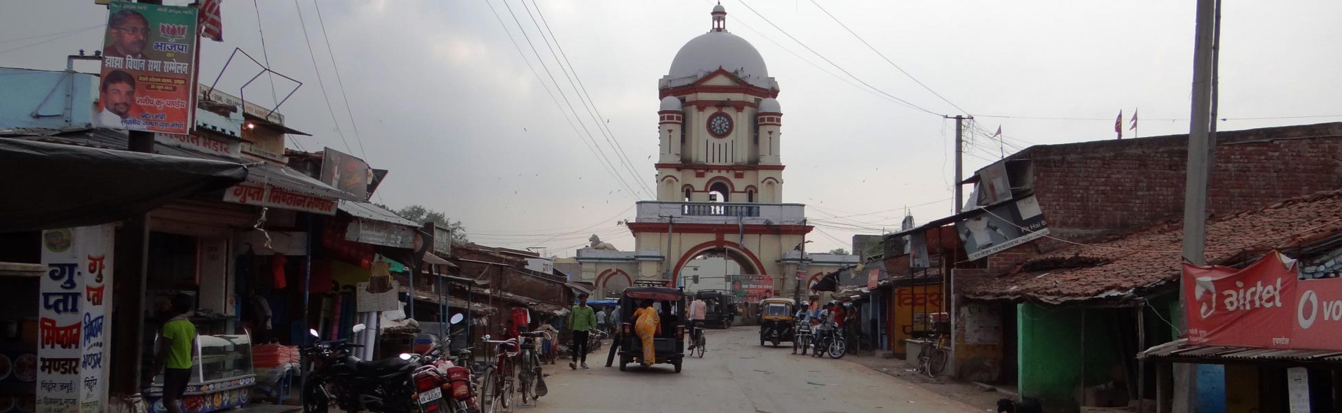 Panoramic street view of the historic Minto Tower gate in Gidhaur, Jamui, Bihar, showing the local market and traditional architecture—a premier heritage film location managed by Trisna Films line production. fixer in Barmer, film fixer in Barmer, media fixer in Barmer, movie fixer in Barmer, production fixer in Barmer, line producer in Barmer