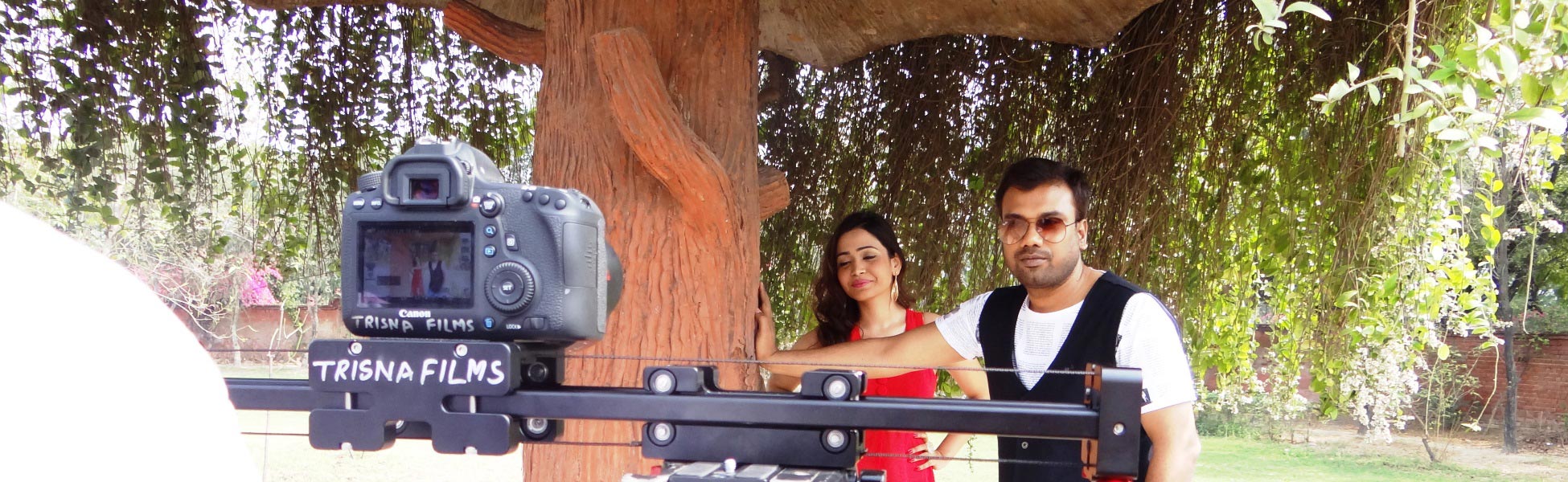 Trisna Films branded DSLR camera and slider setup on location during a music video shoot with actors in Delhi, India. fixer in Bengaluru Rural, film fixer in Bengaluru Rural, media fixer in Bengaluru Rural, movie fixer in Bengaluru Rural, production fixer in Bengaluru Rural, line producer in Bengaluru Rural