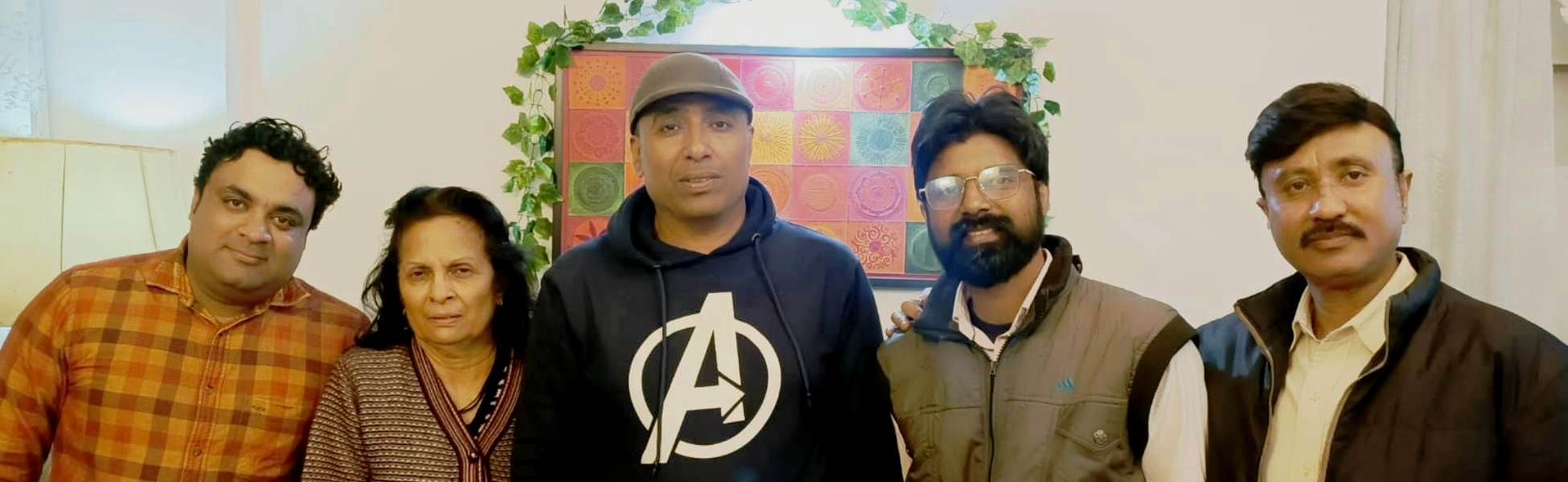 The Trisna Films® cast and crew posing together indoors during the production of a short film in New Delhi, India, featuring Director Avinash Kumar in a blue Avengers hoodie. filmmaking workshop in india, cinematography workshop in india, camera workshop in india, editing workshop in india, vfx workshop in india, animation workshop in india, photography workshop in india, direction workshop in india, script writing workshop in india