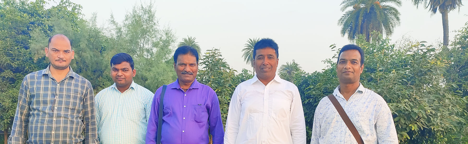 Five male members of the Trisna Films® multi-camera crew standing outdoors in front of trees during a sports documentary production in Faridabad. Fixer in Amnat Charoen, fixer in Ang Thong, fixer in Bangkok, fixer in Bueng Kan, fixer in Buriram, fixer in Chachoengsao, fixer in Chai Nat, fixer in Chaiyaphum, fixer in Chanthaburi, fixer in Chiang Mai, fixer in Chiang Rai, fixer in Chonburi, fixer in Chumphon, fixer in Kalasin, fixer in Kamphaeng Phet, fixer in Kanchanaburi, fixer in Khon Kaen, fixer in Krabi, fixer in Lampang, fixer in Lamphun, fixer in Loei, fixer in Lopburi, fixer in Mae Hong Son, fixer in Maha Sarakham, fixer in Mukdahan, fixer in Nakhon Nayok, fixer in Nakhon Pathom, fixer in Nakhon Phanom, fixer in Nakhon Ratchasima, fixer in Nakhon Sawan, fixer in Nakhon Si Thammarat, fixer in Nan, fixer in Narathiwat, fixer in Nong Bua Lamphu, fixer in Nong Khai, fixer in Nonthaburi, fixer in Pathum Thani, fixer in Pattani, fixer in Phang Nga, fixer in Phatthalung, fixer in Phayao, fixer in Phetchabun, fixer in Phetchaburi, fixer in Phichit, fixer in Phitsanulok, fixer in Phra Nakhon Si Ayutthaya, fixer in Phrae, fixer in Phuket, fixer in Prachinburi, fixer in Prachuap Khiri Khan, fixer in Ranong, fixer in Ratchaburi, fixer in Rayong, fixer in Roi Et, fixer in Sa Kaeo, fixer in Sakon Nakhon, fixer in Samut Prakan, fixer in Samut Sakhon, fixer in Samut Songkhram, fixer in Saraburi, fixer in Satun, fixer in Sing Buri, fixer in Sisaket, fixer in Songkhla, fixer in Sukhothai, fixer in Suphan Buri, fixer in Surat Thani, fixer in Surin, fixer in Tak, fixer in Trang, fixer in Trat, fixer in Ubon Ratchathani, fixer in Udon Thani, fixer in Uthai Thani, fixer in Uttaradit, fixer in Yala, fixer in Yasothon. Line producer in Amnat Charoen, line producer in Ang Thong, line producer in Bangkok, line producer in Bueng Kan, line producer in Buriram, line producer in Chachoengsao, line producer in Chai Nat, line producer in Chaiyaphum, line producer in Chanthaburi, line producer in Chiang Mai, line producer in Chiang Rai, line producer in Chonburi, line producer in Chumphon, line producer in Kalasin, line producer in Kamphaeng Phet, line producer in Kanchanaburi, line producer in Khon Kaen, line producer in Krabi, line producer in Lampang, line producer in Lamphun, line producer in Loei, line producer in Lopburi, line producer in Mae Hong Son, line producer in Maha Sarakham, line producer in Mukdahan, line producer in Nakhon Nayok, line producer in Nakhon Pathom, line producer in Nakhon Phanom, line producer in Nakhon Ratchasima, line producer in Nakhon Sawan, line producer in Nakhon Si Thammarat, line producer in Nan, line producer in Narathiwat, line producer in Nong Bua Lamphu, line producer in Nong Khai, line producer in Nonthaburi, line producer in Pathum Thani, line producer in Pattani, line producer in Phang Nga, line producer in Phatthalung, line producer in Phayao, line producer in Phetchabun, line producer in Phetchaburi, line producer in Phichit, line producer in Phitsanulok, line producer in Phra Nakhon Si Ayutthaya, line producer in Phrae, line producer in Phuket, line producer in Prachinburi, line producer in Prachuap Khiri Khan, line producer in Ranong, line producer in Ratchaburi, line producer in Rayong, line producer in Roi Et, line producer in Sa Kaeo, line producer in Sakon Nakhon, line producer in Samut Prakan, line producer in Samut Sakhon, line producer in Samut Songkhram, line producer in Saraburi, line producer in Satun, line producer in Sing Buri, line producer in Sisaket, line producer in Songkhla, line producer in Sukhothai, line producer in Suphan Buri, line producer in Surat Thani, line producer in Surin, line producer in Tak, line producer in Trang, line producer in Trat, line producer in Ubon Ratchathani, line producer in Udon Thani, line producer in Uthai Thani, line producer in Uttaradit, line producer in Yala, line producer in Yasothon.