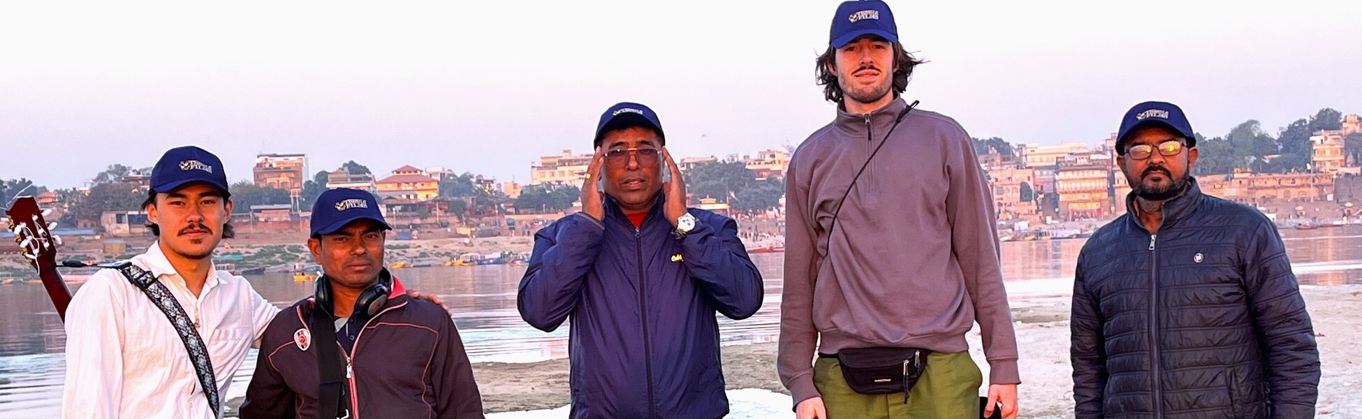 International documentary film production crew from Trisna Films and the Netherlands on location in Varanasi, India, with historic ghats in the background. film production house in Angul, video production house in Angul, tv production house in Angul, production house in Angul, film production company in Angul, video production company in Angul, tv production company in Angul, production company in Angul