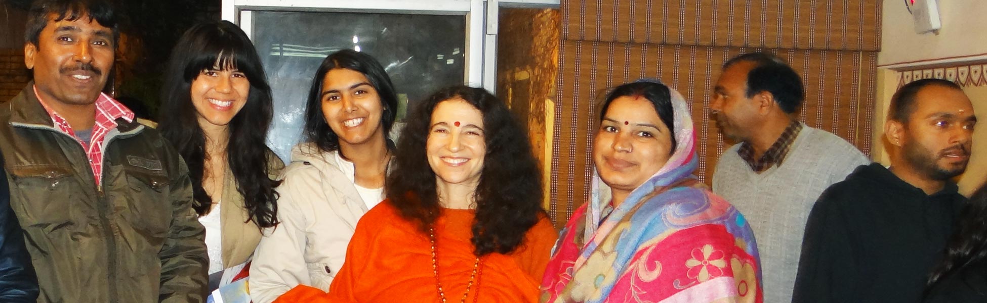 Trisna Films® production crew and US clients posing with renowned motivational speaker Sadhvi Bhagawati Saraswati during the filming of the 'Eight Limbs' yoga documentary in Rishikesh, Uttarakhand, India. film shooting locations in india, film shooting locations in Delhi, film shooting locations in mumbai, film shooting locations in pune, film shooting locations in sonipat, film shooting locations in begusarai, video shooting locations in india, video shooting locations in Delhi, video shooting locations in mumbai, video shooting locations in pune, video shooting locations in sonipat, video shooting locations in begusarai, tv shooting locations in india, tv shooting locations in delhi, tv shooting locations in mumbai, tv shooting locations in pune, tv shooting locations in sonipat, tv shooting locations in begusarai, shooting locations in india, shooting locations in delhi, shooting locations in mumbai, shooting locations in pune, shooting locations in sonipat, shooting locations in begusarai