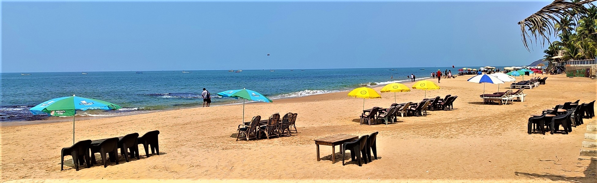 Goa, Anjuna Beach ad film production managed by Trisna Films®. The photo shows a professional set arrangement with beach umbrellas and seating, demonstrating expert line production and location management in India. film production house in Ashoknagar, video production house in Ashoknagar, tv production house in Ashoknagar, production house in Ashoknagar, film production company in Ashoknagar, video production company in Ashoknagar, tv production company in Ashoknagar, production company in Ashoknagar