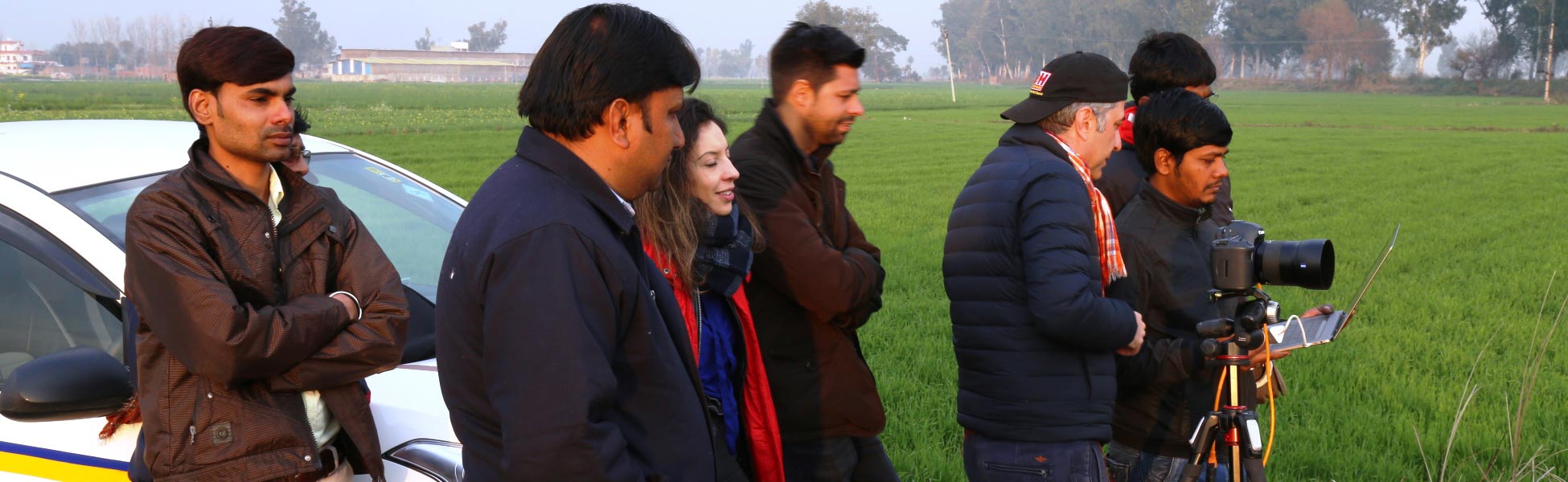 Behind the scenes of a web series production in Ludhiana, Punjab, showcasing the Trisna Films® technical crew and international clients collaborating on location in a green agricultural field. filmmaking workshop in india, filmmaking workshop in delhi, filmmaking workshop in mumbai, filmmaking workshop in pune, filmmaking workshop in sonipat, filmmaking workshop in begusarai, cinematography workshop in india, cinematography workshop in delhi, cinematography workshop in mumbai, cinematography workshop in pune, cinematography workshop in sonipat, cinematography workshop in begusarai, camera workshop in india, camera workshop in delhi, camera workshop in mumbai, camera workshop in pune, camera workshop in sonipat, camera workshop in begusarai, editing workshop in india, editing workshop in delhi, editing workshop in mumbai, editing workshop in pune, editing workshop in sonipat, editing workshop in begusarai, vfx workshop in india, vfx workshop in Delhi, vfx workshop in mumbai, vfx workshop in pune, vfx workshop in sonipat, vfx workshop in begusarai, animation workshop in india, animation workshop in Delhi, animation workshop in mumbai, animation workshop in pune, animation workshop in sonipat, animation workshop in begusarai, photography workshop in india, photography workshop in delhi, photography workshop in mumbai, photography workshop in pune, photography workshop in sonipat, photography workshop in begusarai, direction workshop in india, direction workshop in delhi, direction workshop in mumbai, direction workshop in pune, direction workshop in sonipat, direction workshop in begusarai, script writing workshop in india, script writing workshop in delhi, script writing workshop in mumbai, script writing workshop in pune, script writing workshop in sonipat, script writing workshop in begusarai